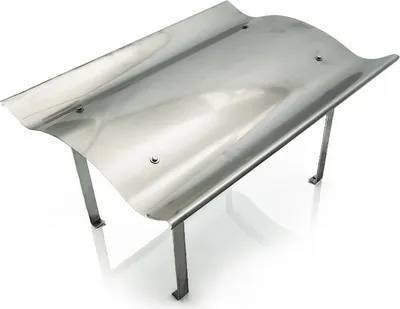 A stainless steel chimney cap with a curved top and four legs, shown from a diagonal angle on a white background.