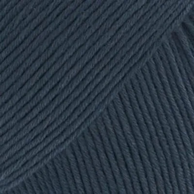 A close-up, textured view of navy blue yarn.