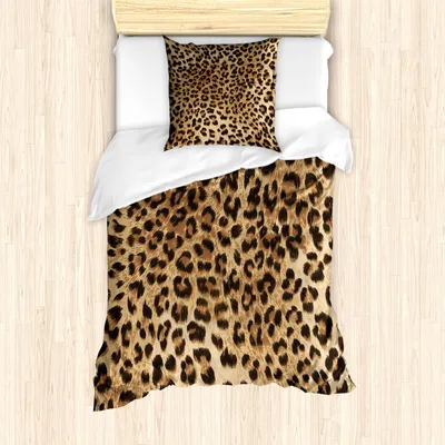 A top-down view of a bed with leopard print bedding.