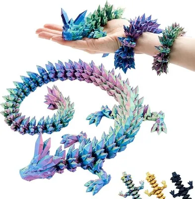 A hand holding a small, crystal-like dragon figurine, with a larger, more elaborate dragon figurine coiled in the foreground. Several smaller dragon figurines are visible at the bottom right.