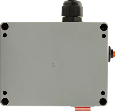 A gray electronic enclosure with a black cable gland on top and a red button on the side.