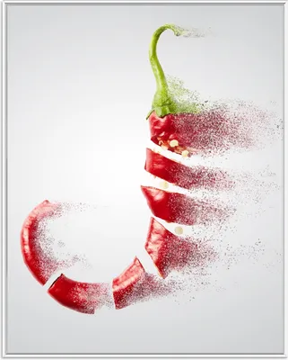 Produktbild von Wallario Wandbild Chilischote löst sich in Pulver auf, Größe: 40,30 x 50,30 cm, Poster mit weißem Aluminiumrahmen