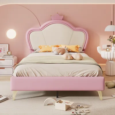 A child's bedroom with a pink bed and crown-shaped headboard.