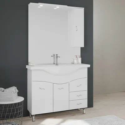 A white bathroom vanity set with a mirror and integrated lighting, set against a dark gray wall and a light gray textured wall.