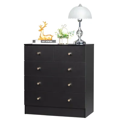 A black dresser with decorative items on top, including a lamp, a deer figurine, and a small plant.