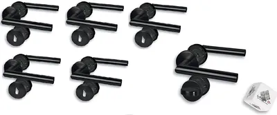 A set of black door handles with keyhole escutcheons, arranged on a white background, with a single die in the lower right corner.