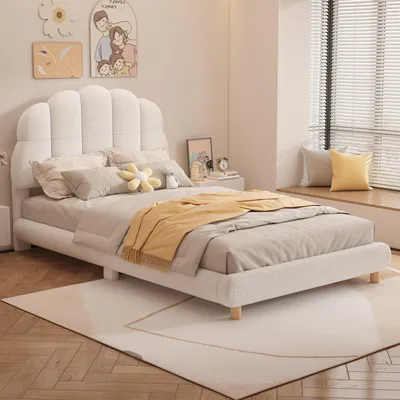 A bedroom scene with a white bed, pillows, and a yellow blanket.