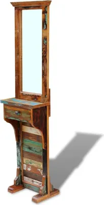 A tall, narrow, free-standing mirror with a shelf and drawer, made from reclaimed wood.
