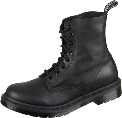 A single black Dr. Martens boot is shown against a white background.
