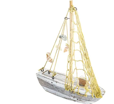 A small decorative wooden sailboat with shells and netting.