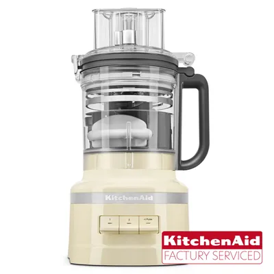 A cream-colored KitchenAid food processor shown from the front against a white background.