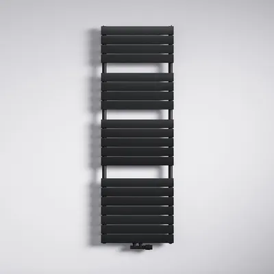 A black radiator is mounted on a white wall.