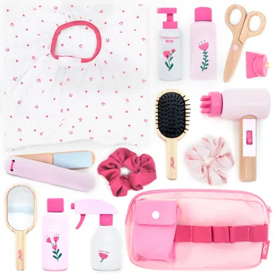 A collection of children's toy hair salon accessories laid out on a white background.