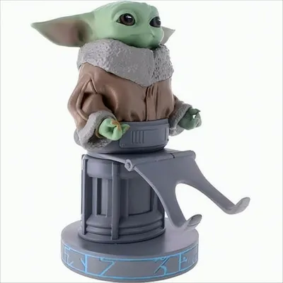 A figurine of Grogu (Baby Yoda) from Star Wars, sitting on a stand.