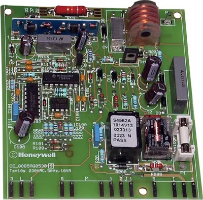 A close-up of a green circuit board with various electronic components.