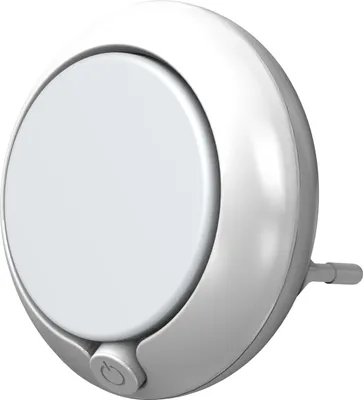 A white, round night light with a power button.