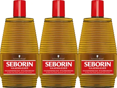 Three bottles of Schwarzkopf Seborin Haarwasser arranged side-by-side on a white background.