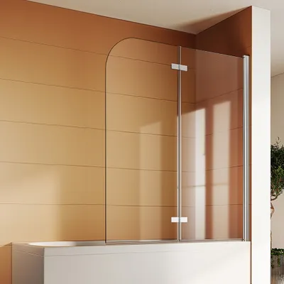 A modern bathroom with a glass shower screen installed over a bathtub.
