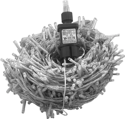 A coiled string of LED lights with a black power adapter in the center.