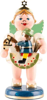 A wooden figurine of an angel holding a small rider on a rocking horse.
