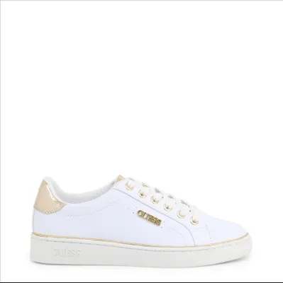 A white Guess sneaker with gold accents is shown against a white background.