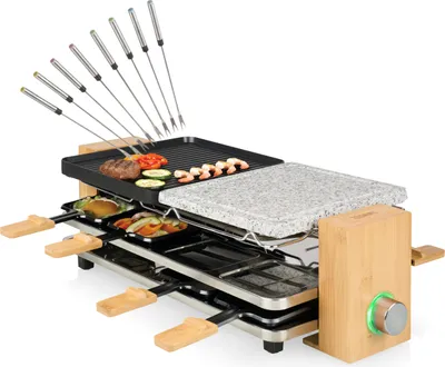 A raclette grill with a stone plate and grilling surface, set against a white background.
