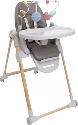 A baby high chair with a toy arch attached.