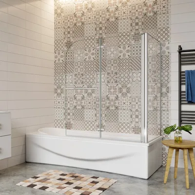 A modern bathroom with a bathtub and shower screen.