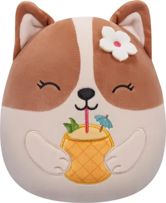 A plush toy dog wearing a flower in its ear and holding a pineapple drink.