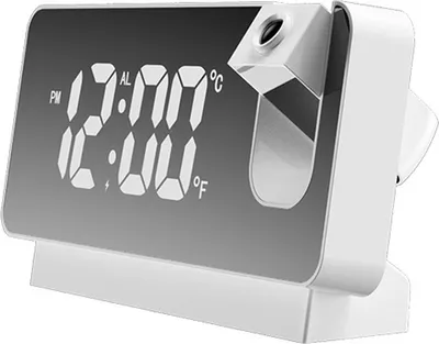 A white digital projection alarm clock with a mirrored display showing the time and temperature.