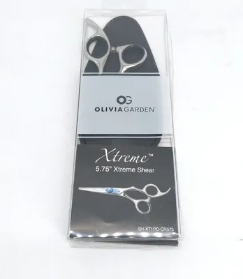 A pair of Olivia Garden Xtreme shears is displayed in its clear plastic packaging.