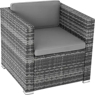 A single rattan armchair with gray cushions, shown from a three-quarter angle against a white background.