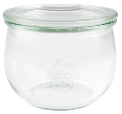 A clear glass jar with a lid, embossed with the brand logo.