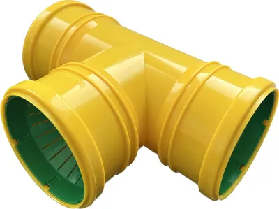 A yellow T-shaped drainage pipe fitting with green interior ends.