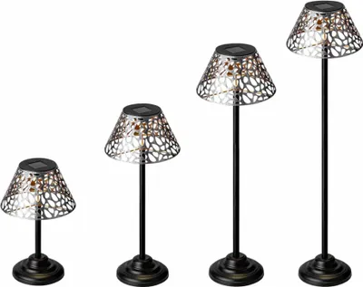 Four solar-powered garden lights of varying heights are displayed against a white background.