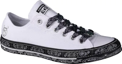 A white Converse Chuck Taylor All Star sneaker with black paisley print accents.
