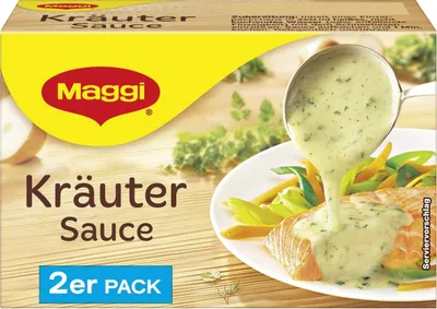 A box of Maggi Kräuter Sauce with a serving suggestion of sauce being poured over salmon and vegetables.