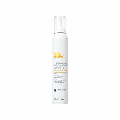 A white can of Milk_Shake Whipped Cream leave-in foam hair product against a white background.