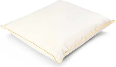 A white pillow with a yellow trim is shown on a white background.