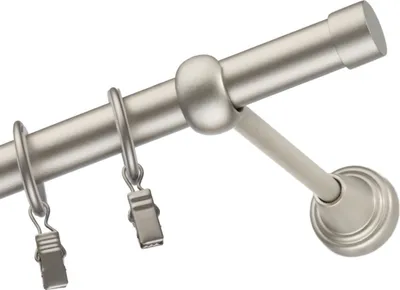 Close-up of a curtain rod with rings and clips.
