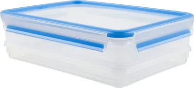 A clear studio shot of a transparent food storage container with a blue lid.
