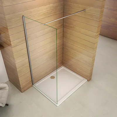 A modern shower enclosure with a glass panel and a silver support bar, set against a wooden wall.