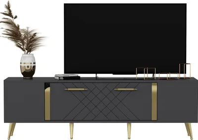 A TV stand with a television on top and decorative items on the stand.