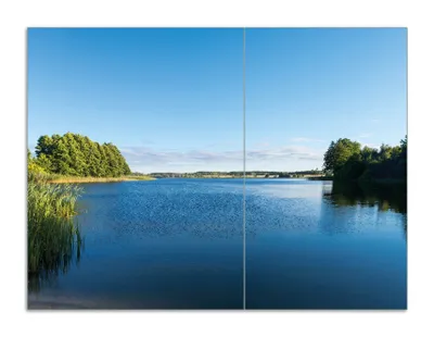 Produktbild von Wallario Herdabdeckplatte aus Glas, Größe 70 x 52 cm 2-teilig, Motiv Malerischer See mit Schilf unter blauem Himmel