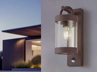 A modern house with an outdoor wall light.