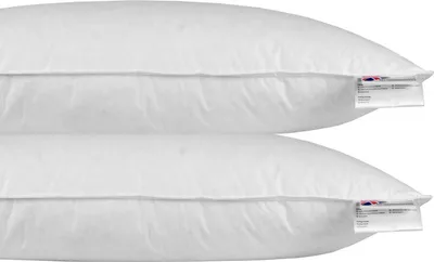 Two white pillows stacked on top of each other.