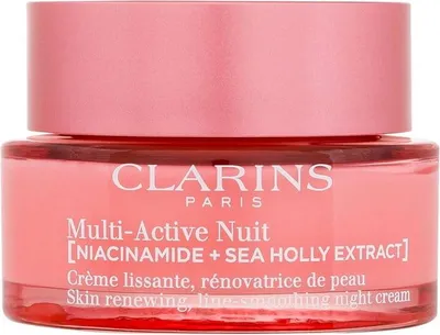 A close-up of a Clarins night cream jar.