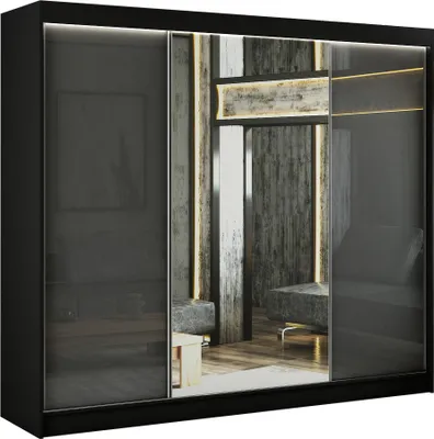 A modern black wardrobe with mirrored sliding doors, reflecting an interior scene.