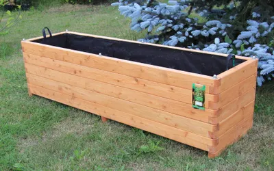 Produktbild von Pflanzkasten 180x50x50cm aus Lärche geschraubt mit Vlies, gerundeten Ecken und Griffen