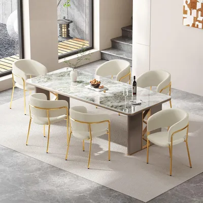 A dining room setting with a marble-top table and six chairs.